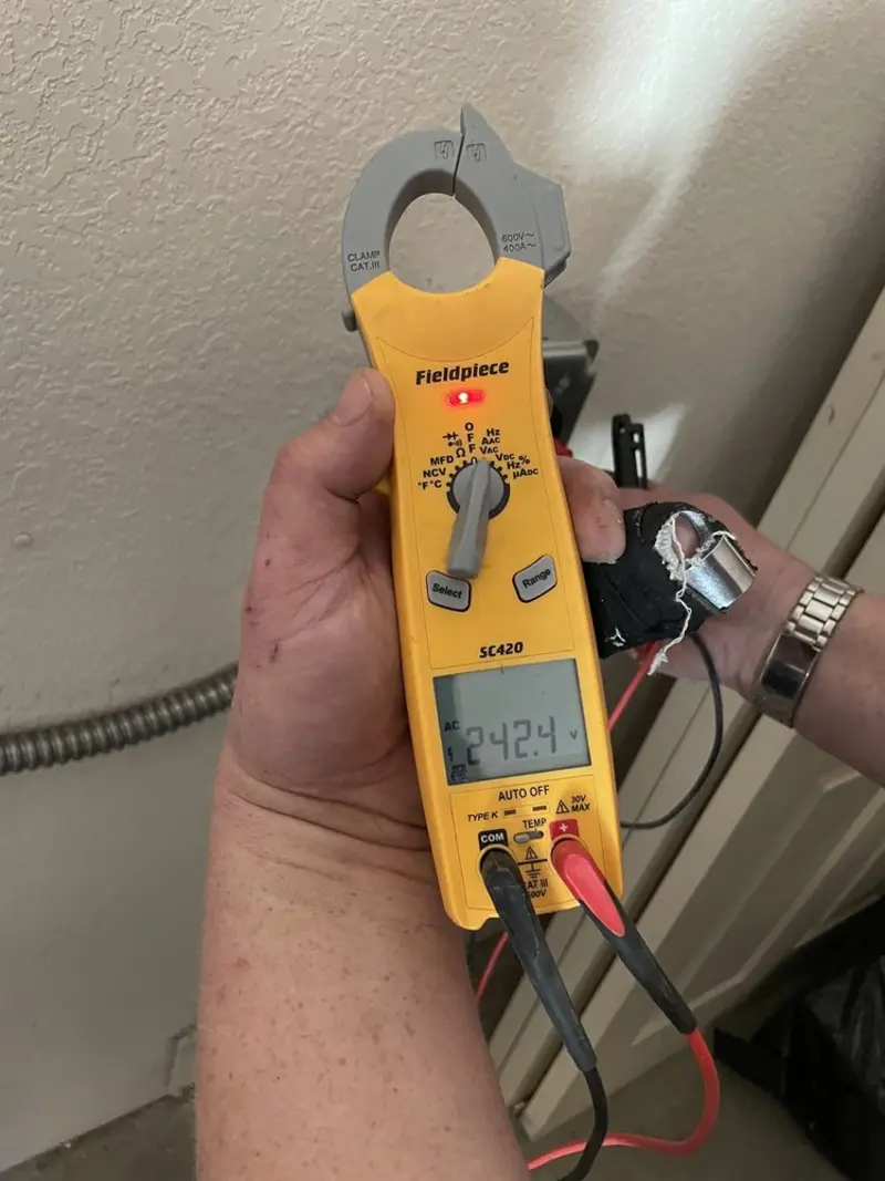 Voltage testing with clamp meter during Generator Installation in Samoset